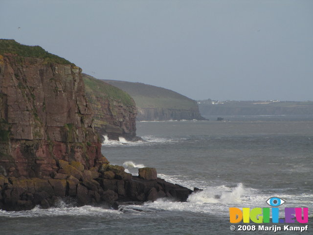 SX01393 Waves crashing against cliffs near Dunmore East